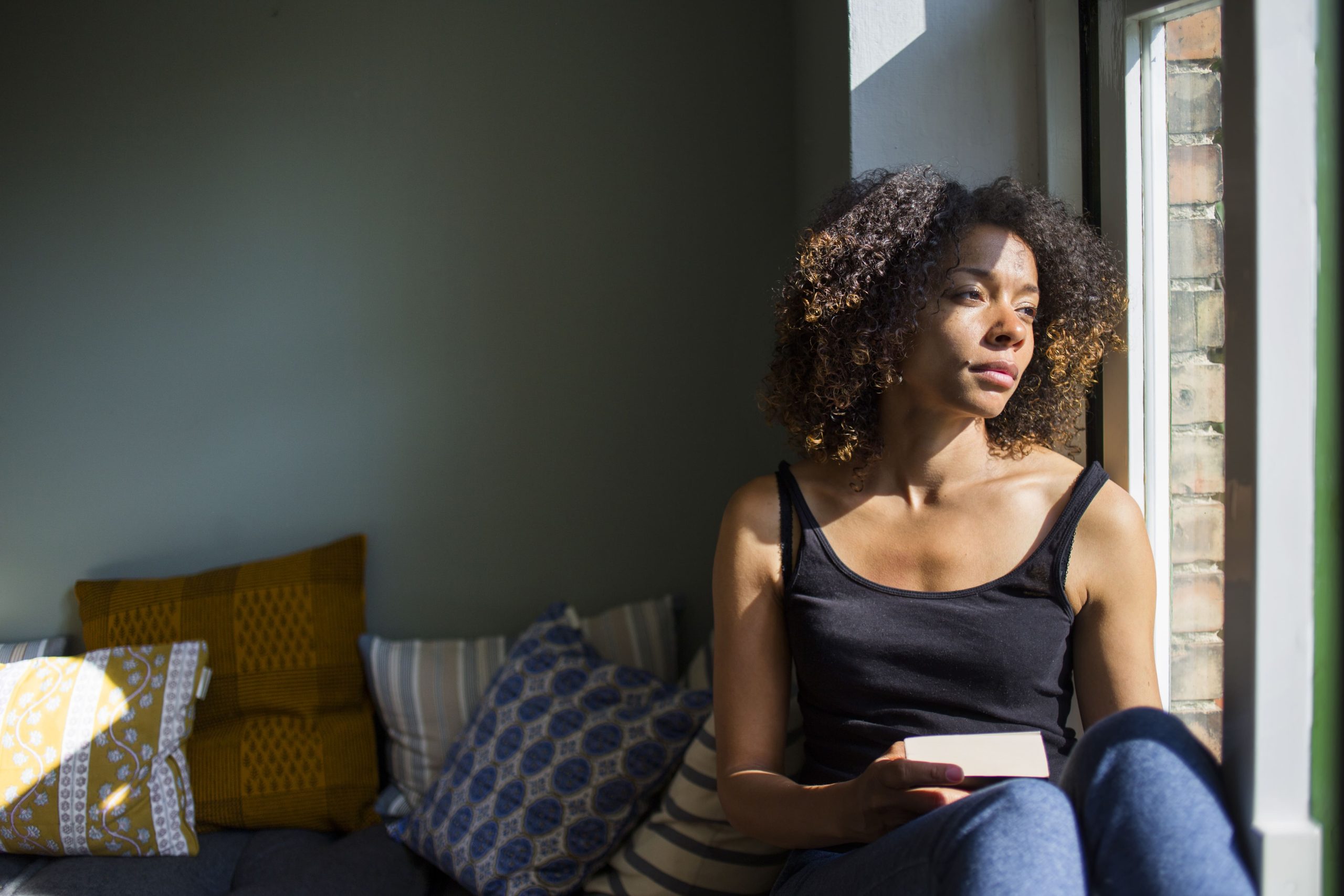 womansittingonsillandlookingthroughwindow20241016005924utc 1 Arcane Guides